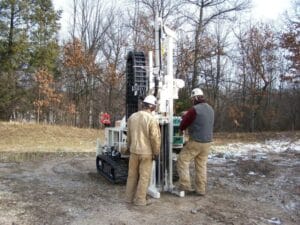 MATECO workers performing direct push drilling at worksite